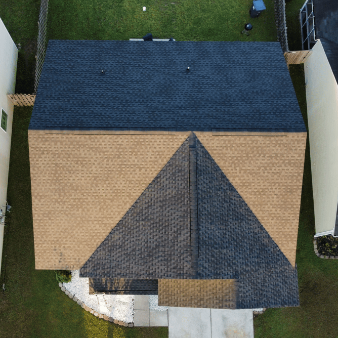 A Charleston roofing company helps maintain roof shingles. 