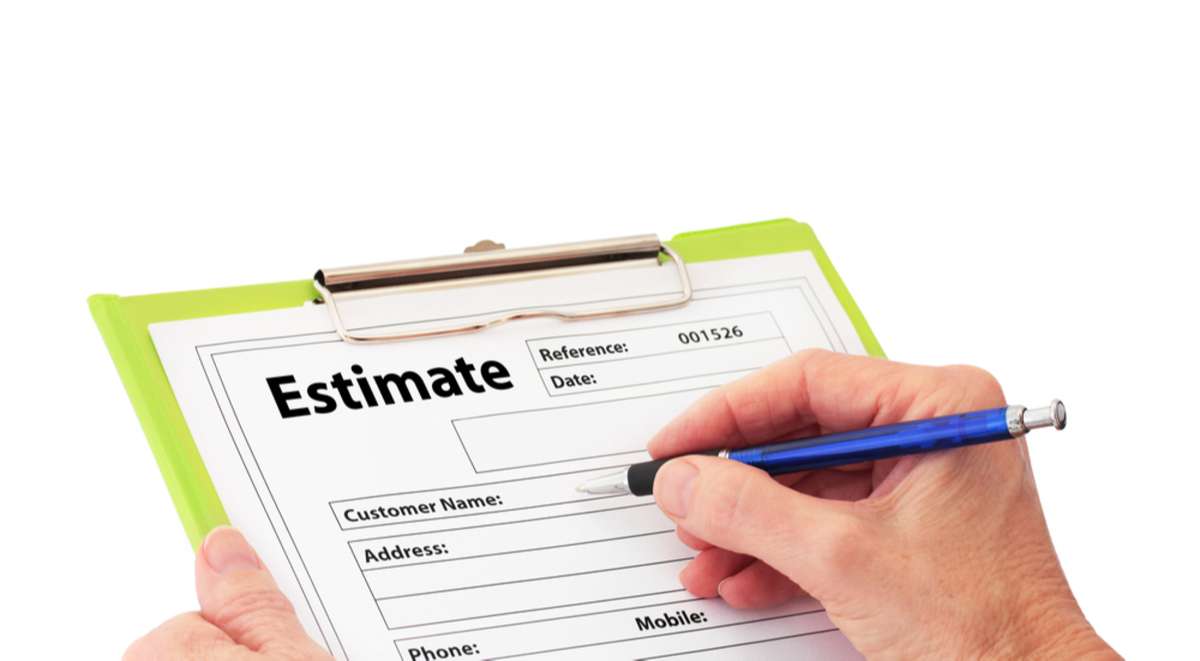 A hand writing on an estimate document, roofing quotes concept