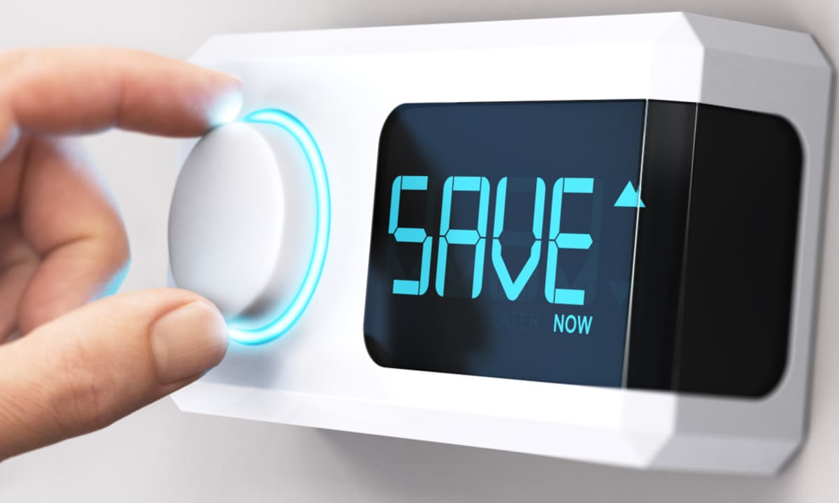 A thermostat that says save, saving with a cool roof coating concept