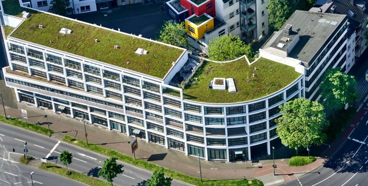 Aerial view of a building with green roofing
