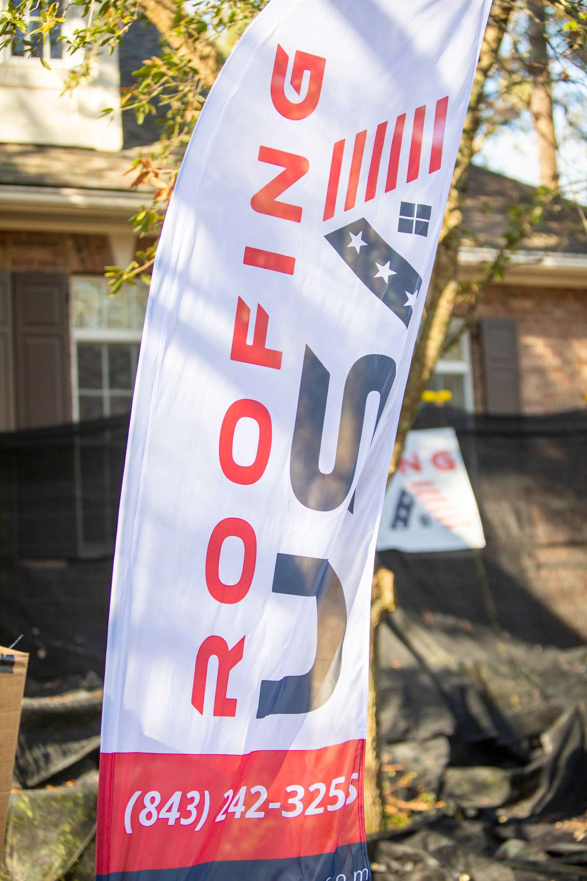 Roofing USA banner flag showing logo and number