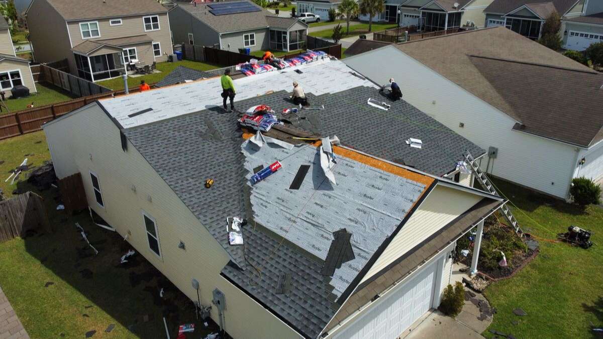 Roofing USA roofers conducting a roof replacement to deliver a better customer experience