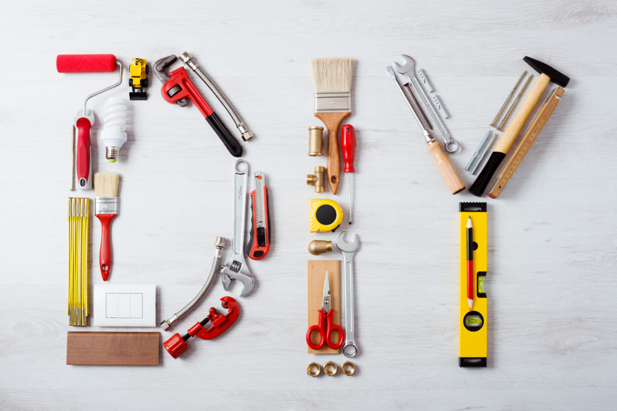 The letters DIY composed of maintenance and construction tools