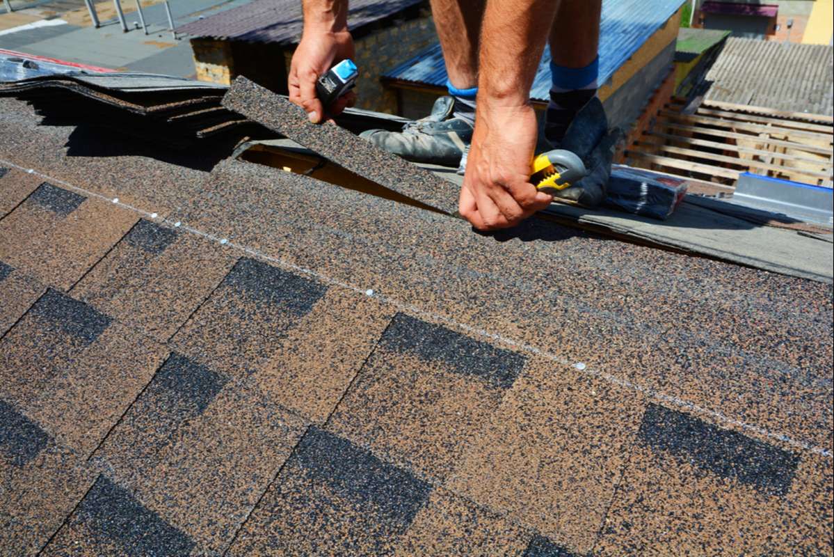 Repairing of roof by cutting felt or bitumen shingles during waterproofing works