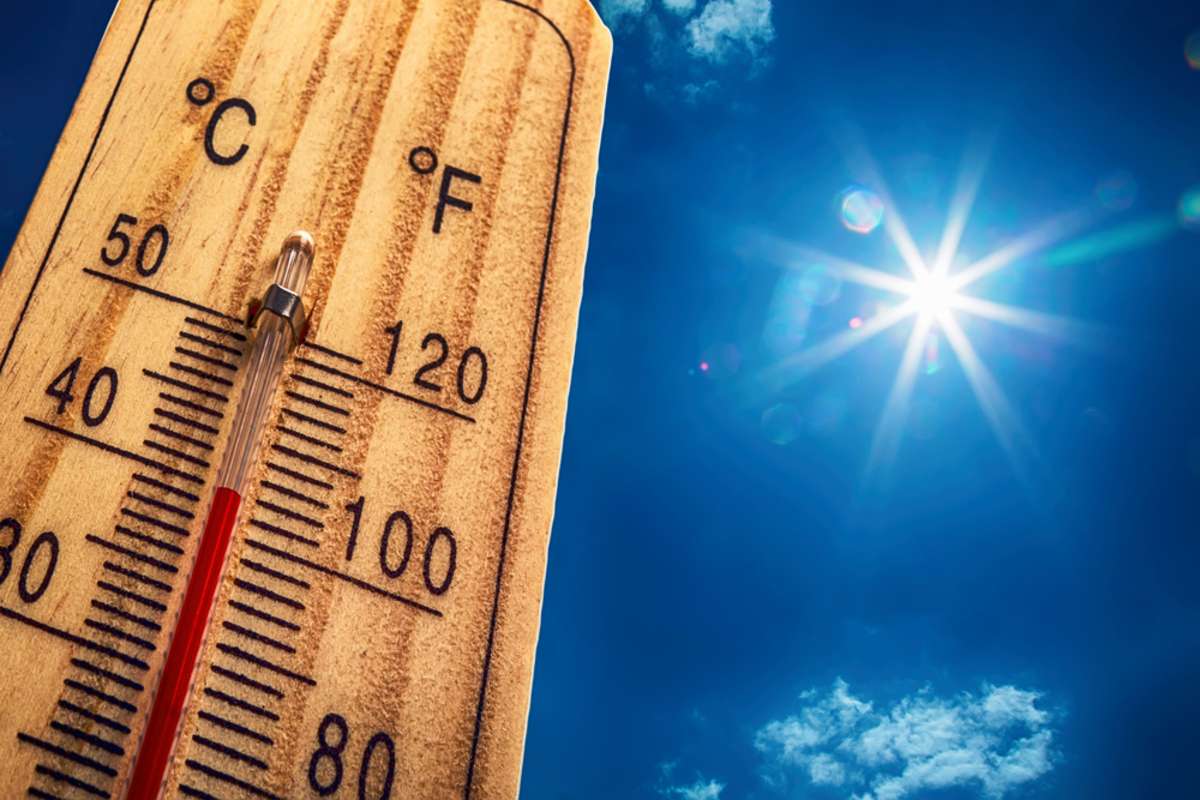 Thermometer displaying high 40 degree hot temperatures in sun summer day