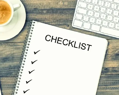A_notebook_labeled_checklist_with_check_marks_down_the_side (1)