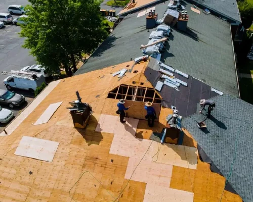 Construction_worker_on_a_renovation_roof_the_house_installed_new_shingles