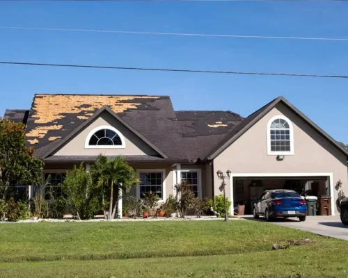 Roofing_contractor_doing_a_roof_replacement_for_a_house