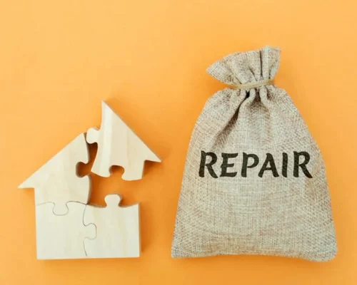The_word_repair_next_to_a_puzzle_home,_roof_repair_concept01