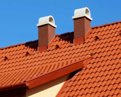 modern_brown_stucco_finished_chimneys_with_white_ceramic_cap_stone