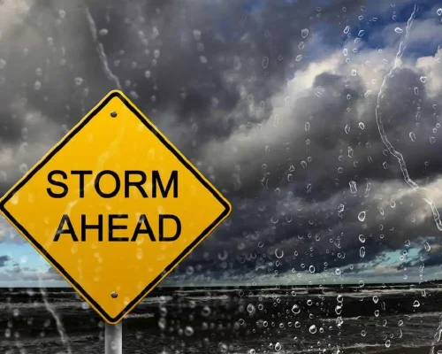 yellow_warning_sign_of_bad_weather_ahead_against_stormy_sky